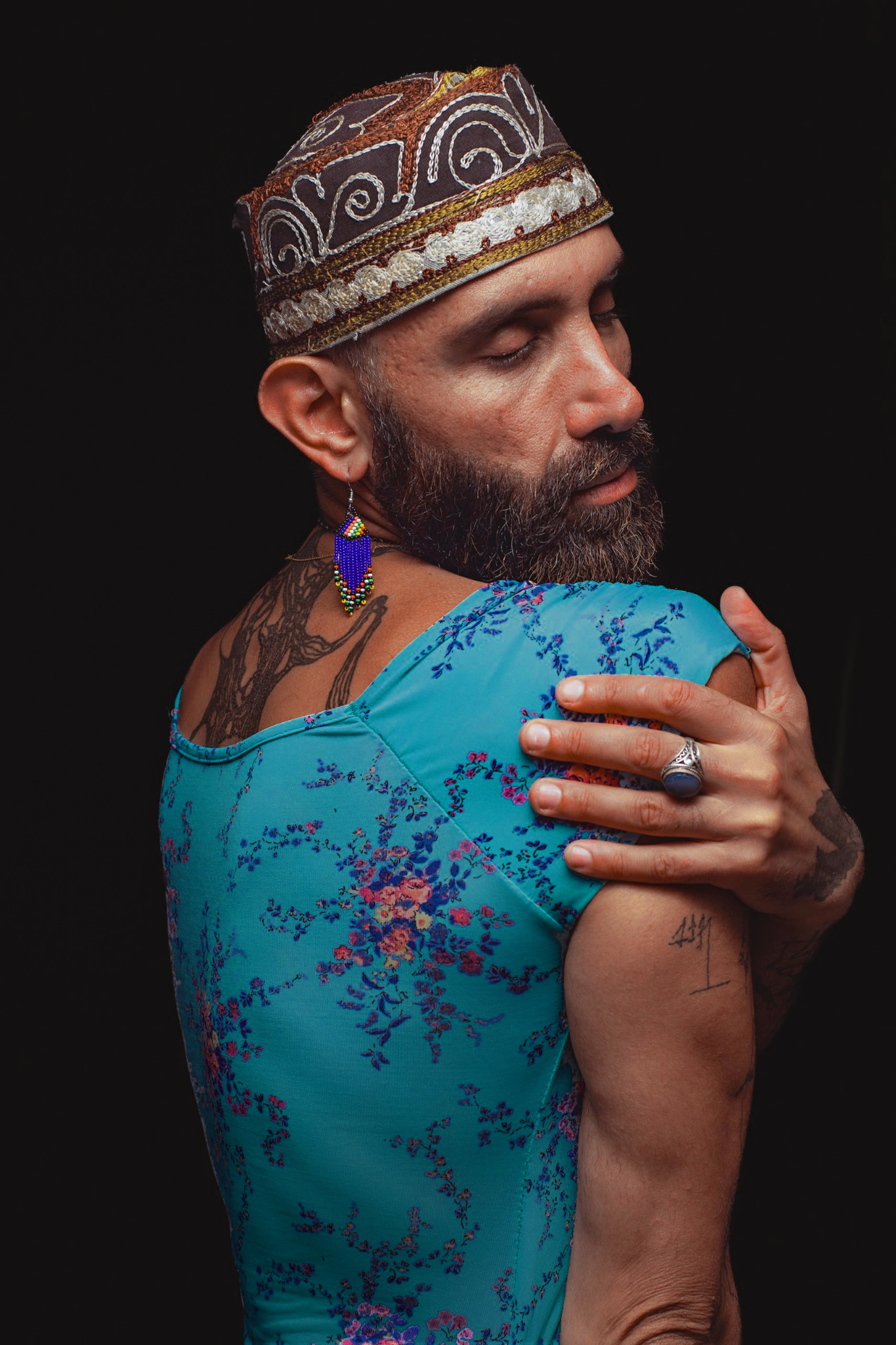 Aladin closes his eyes, with one hand resting across his upper body.